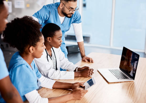 Young students attending an online webinar / laptop screen / healthcare presentation.